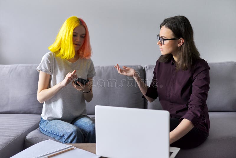 Teen student girl 15, 16 years old has individual lesson from young woman teacher. Teen student girl 15, 16 years old has individual lesson from young women stock photography
