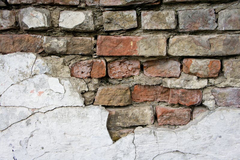 The texture of bricks and plasters, dilapidated and destroyed.  stock photo