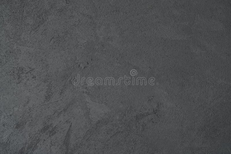 Texture of dark gray wall with decorative plaster concrete effect. Good for background stock image