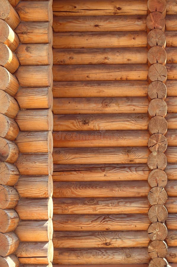 Texture parallel folded treated timber. Ancient technology building of Russian log hut, wood house cottages and churches. Texture in parallel folded logs. The stock images