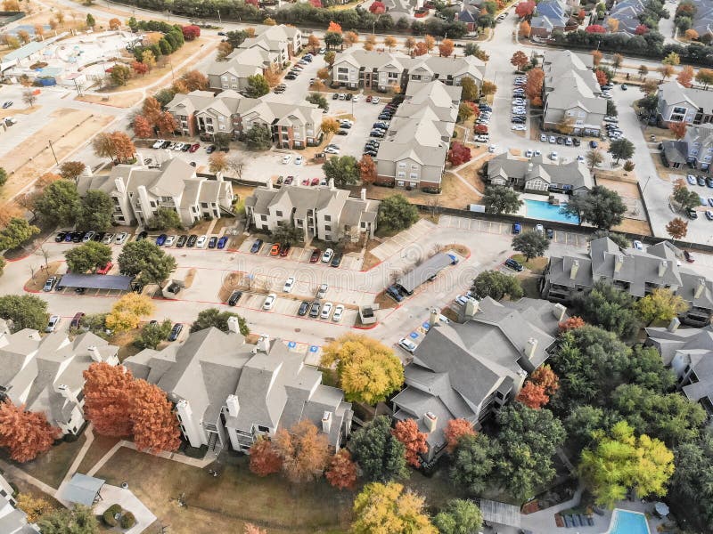 Top view apartment building rental housing subdivision in fall s. Aerial view apartment building complex with colorful fall foliage leaves near suburban Dallas royalty free stock photo