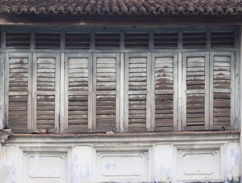 Traditional tropical louvred wooden windows royalty free stock photo