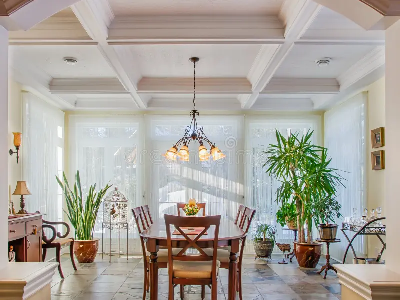 Vaulted ceilings in luxury yellow dining room stock photography