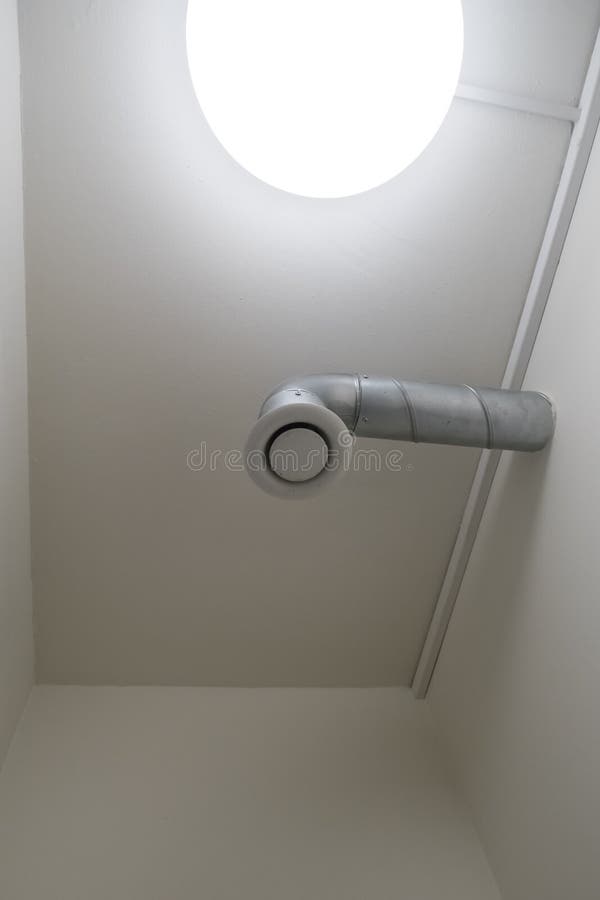 Ventilation in the toilet. This modern ventilation in the toilet of a large building in the city stock image