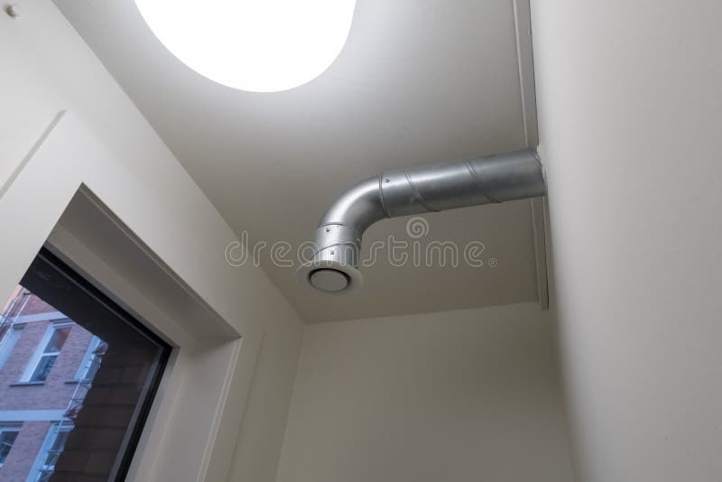 Ventilation in the toilet. This modern ventilation in the toilet of a large building in the city stock images