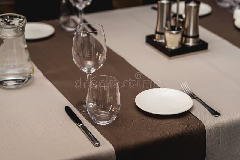 View of the served table in a restaurant. beige brown tones stock photos