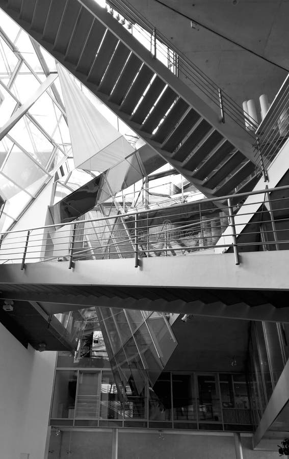 Modern stairs inside the building. View to the modern multistory stairs inside the building. Modern interior design stock images