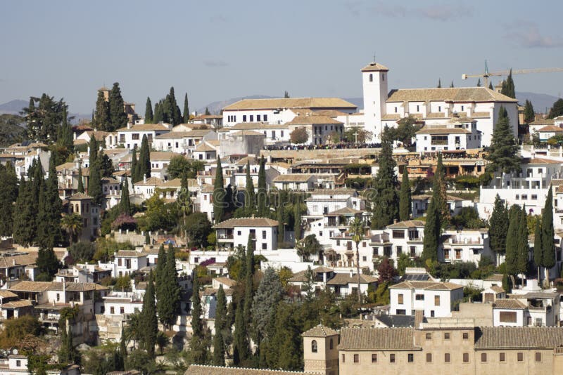 View of the white-colored buildings with light orange ceilings of a city during the daytime. A view of the white-colored buildings with light orange ceilings of royalty free stock images