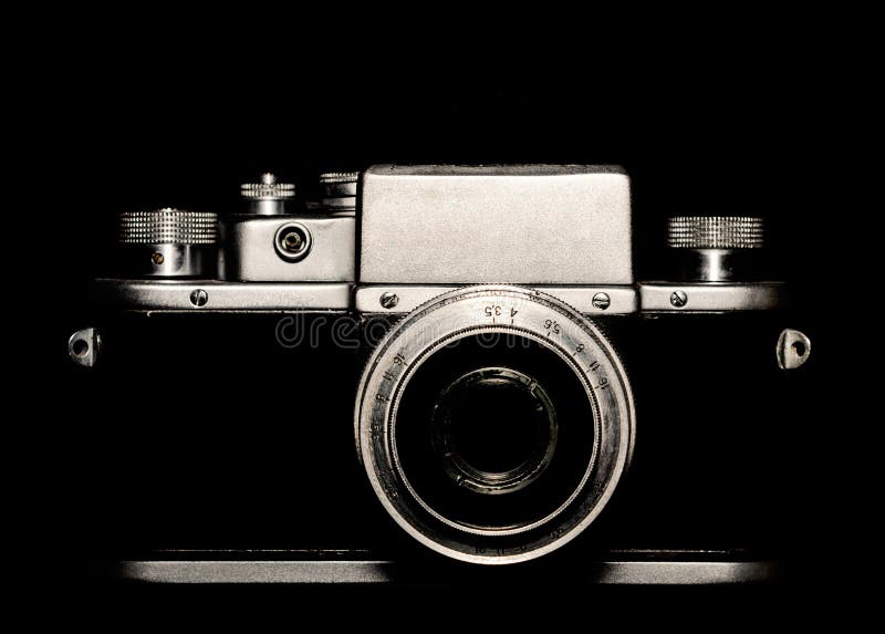 Vintage camera on black background closeup. Vintage camera on black background close up stock photography