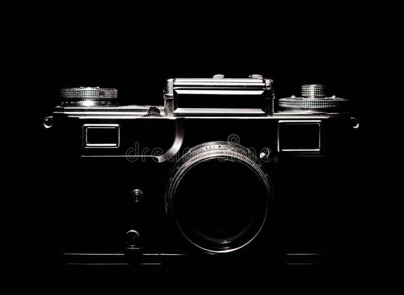 Vintage camera silhouette in the dark. Close up stock photography