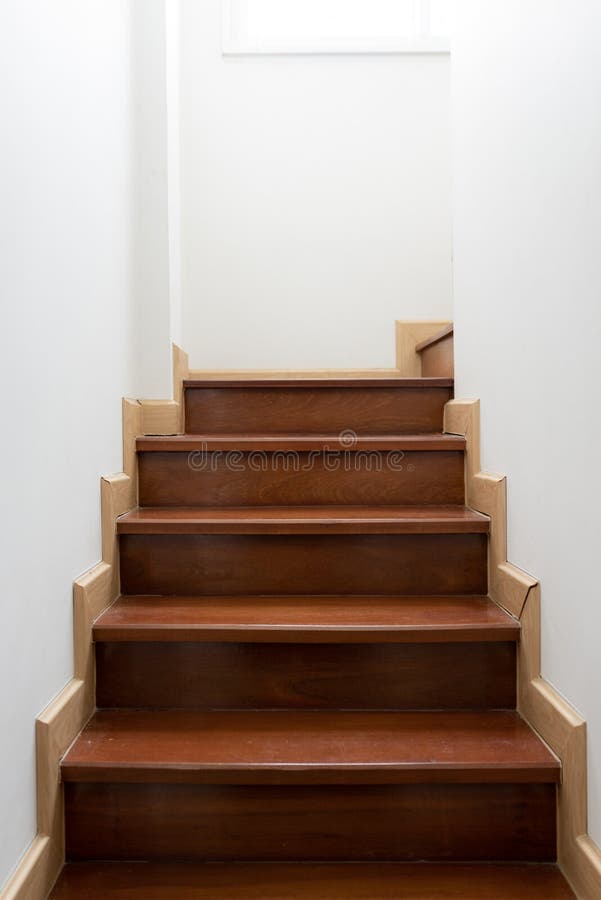 Vintage wooden staircase in home. The stairs up inside the house that painted the white walls stock images