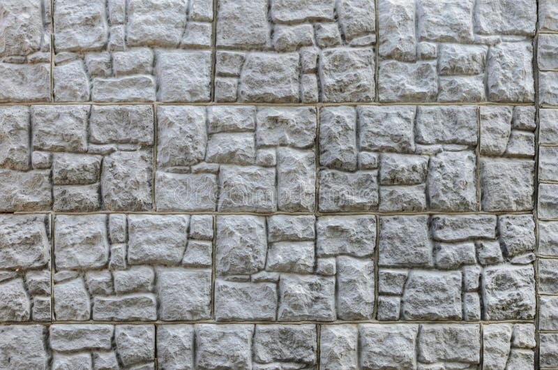 Wall made of artificial stone. Finishing the facade of the building. Texture. Wall made of artificial stone. Finishing the facade of the building royalty free stock image