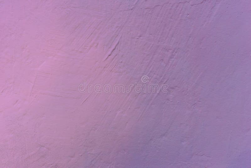 A wall with rough texture of plaster unevenly painted in purple. Photo of a wall with rough texture of plaster unevenly painted in purple stock photos