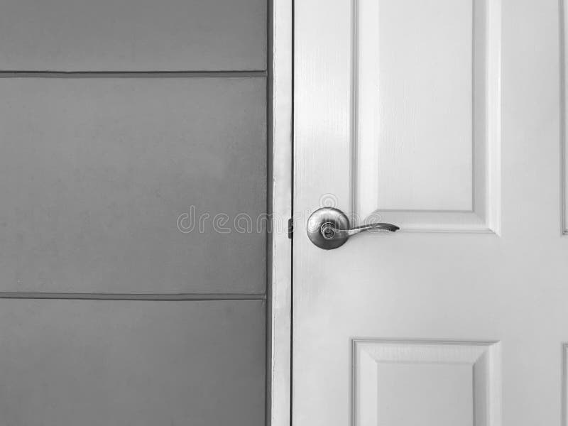 White close wooden door and gray wall, black and white tone stock images
