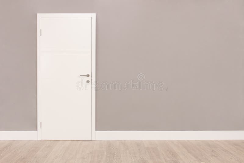 White door in an empty room stock photo