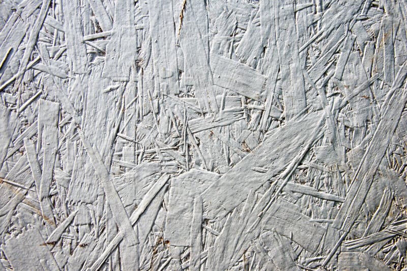 White grunge painted one layer oriented strand board OSB. Vintage OSB. Close up pressed wooden panel background or texture stock photos