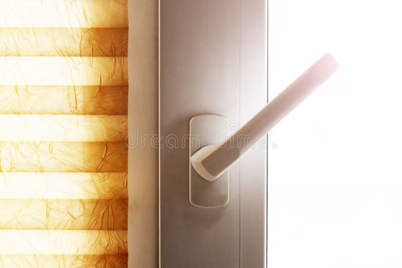 White plastic window or door detail with handle so close. White plastic window or door detail with handle royalty free stock photo