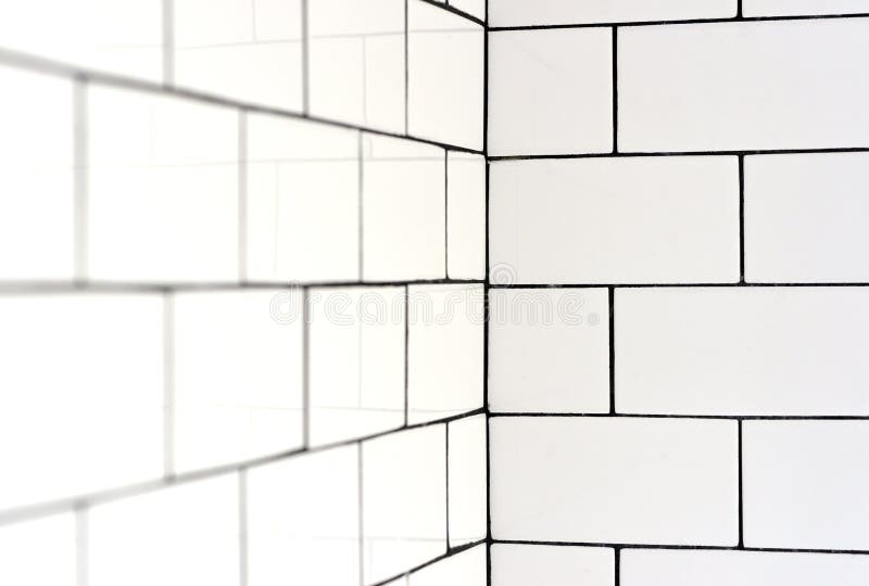 White vintage metro tiles. And black grout in a bathroom stock photography