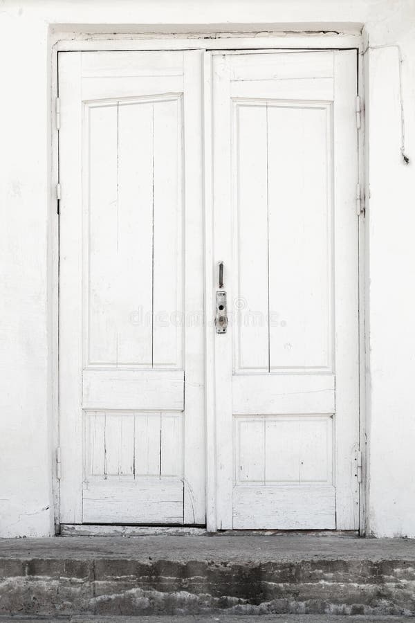 White wall and door, background texture. White wall and wooden door, background texture royalty free stock photo