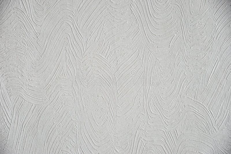 White wall texture, decorative plaster, background, texture for decoration. Beautiful white wall texture, decorative plaster, curved lines, background, texture royalty free stock photos