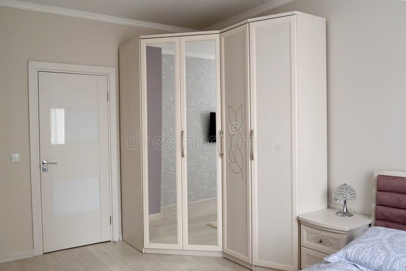 White wardrobe in a bedroom interior. Scandinavian style royalty free stock photos