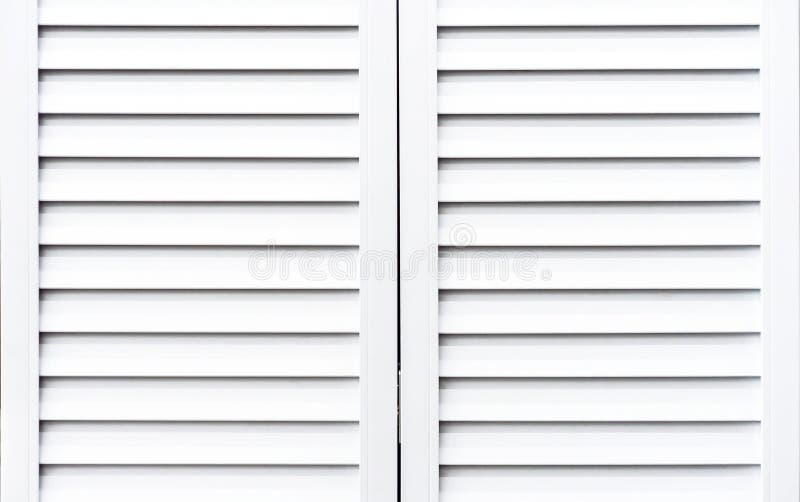 White wooden shutters to protect windows from sunlight royalty free stock image