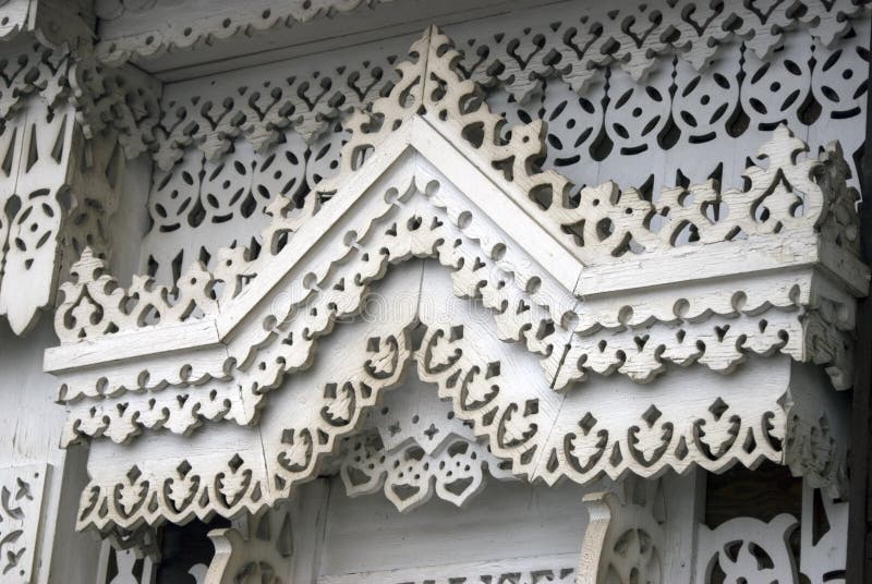 A window of a wooden county house decorated by white frames. No people. Color photo royalty free stock photos