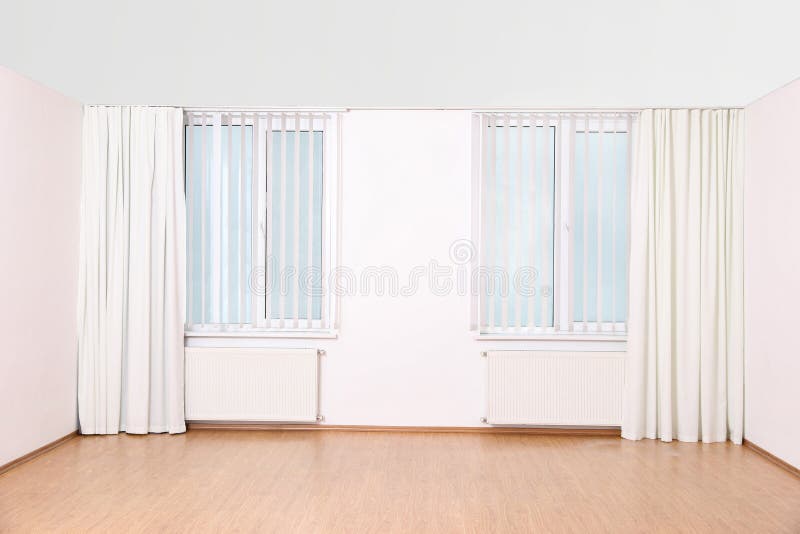 Windows with curtains and blinds in empty room royalty free stock image