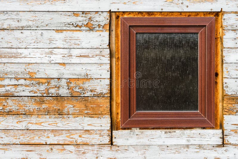 Windows installed in old wooden house, peeling paint on wooden planks, wearing texture stock photos