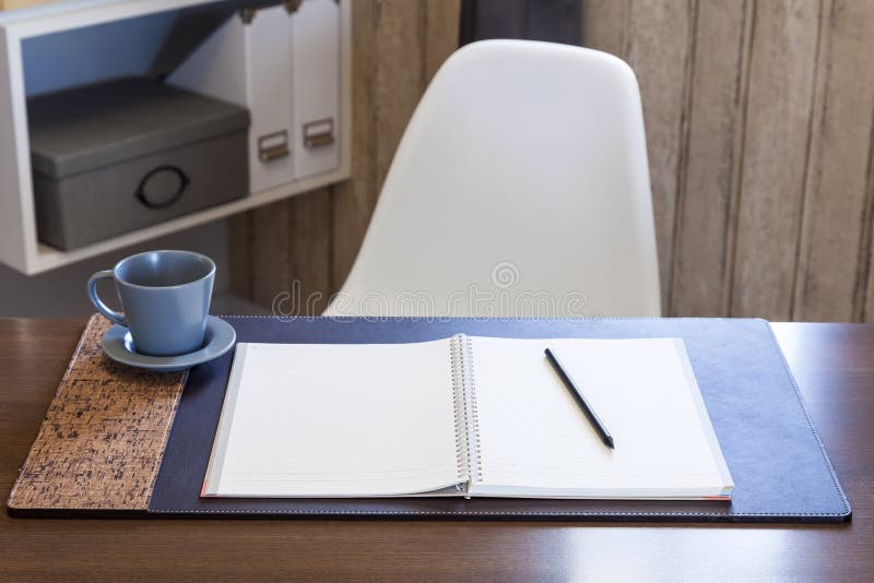 Woking table with book pen and coffee home interior royalty free stock image