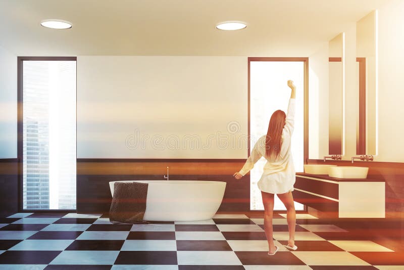 Woman in loft white gray bathroom interior stock photography
