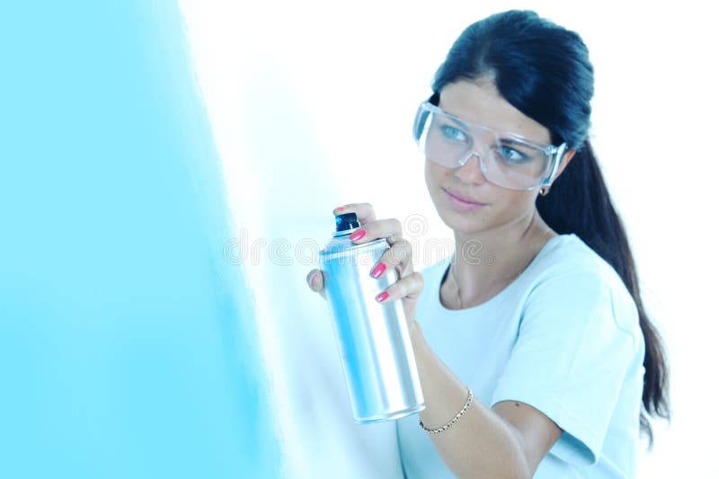 Woman paints the wall royalty free stock image