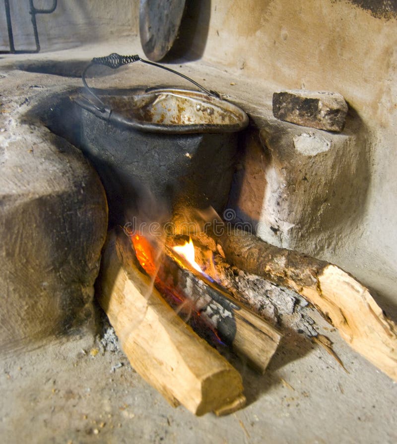 Wood burning stove. A traditional rural wood burning stove in a old country home stock photo