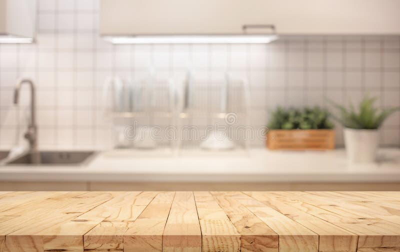 Wood table top on blur kitchen counter roombackground. For montage product display or design key visual layout royalty free stock image