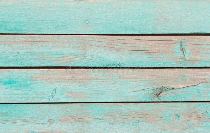 Wooden background, a fragment of the wall of an old wooden house painted in turquoise royalty free stock photos