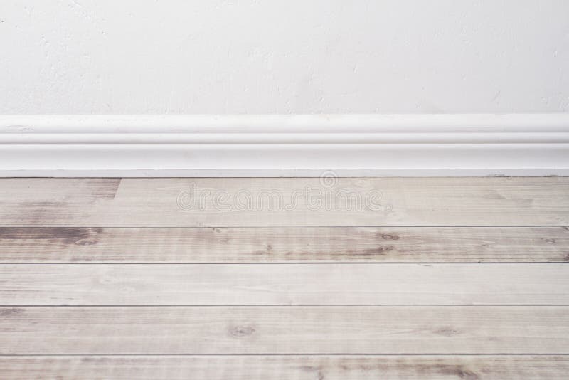 Wooden floor and plaster skirting board. royalty free stock photos