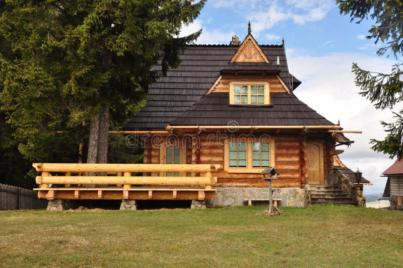 Wooden house. Cottage highland, small  in the forest stock photos