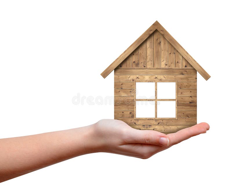 Wooden house in hand. Isolated on white background stock photos