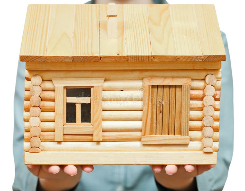 Wooden house on palms. Hand gesture isolated on white background stock photos