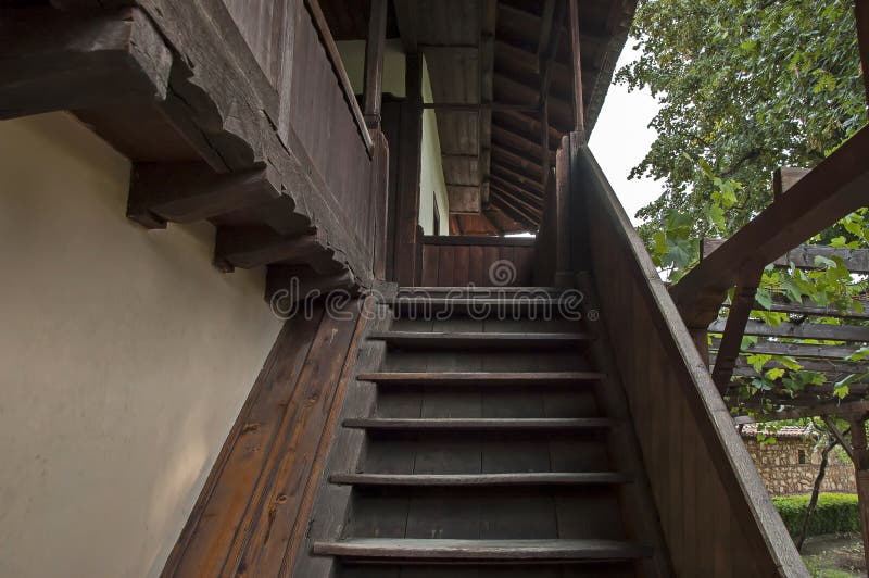 A wooden staircase to the entrance of the second floor of an old Bulgarian house stock photo