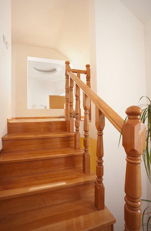 Wooden stairs. In house, interior decoration, wood and white walls stock photos