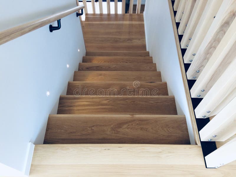 Wooden stairs, modern staircase, home interior. Going down steps turn corner view. new building stock images