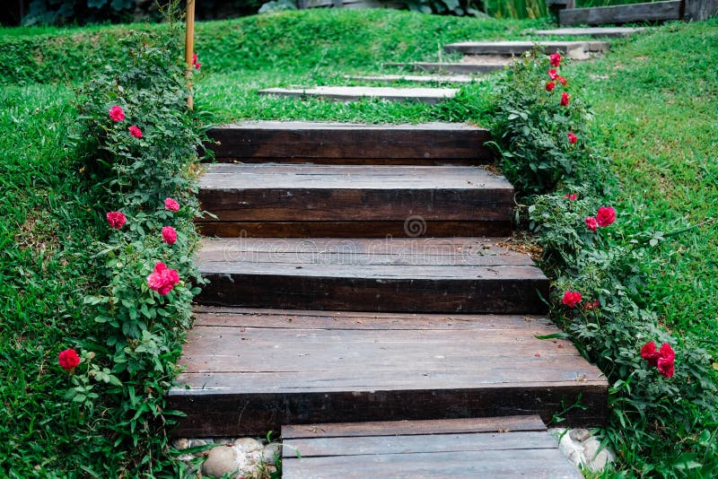 Wooden stairs stairstep staircase in garden. Park stock photo