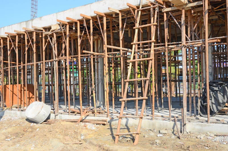 Wooden stairs to second floor of building construction. With wooden scaffold stock photo