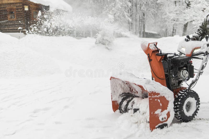 The worker removes the snow with a plow. Landscape in winter, Ru royalty free stock photography