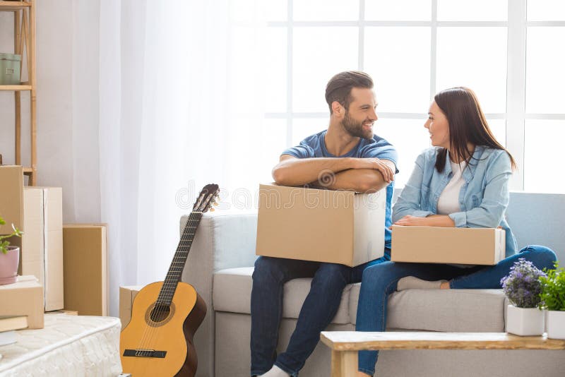 Young couple moving to a new apartment together relocation stock photography