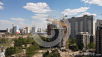 Aerial view of building construction site with crane and workers stock video footage