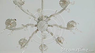 A beautiful antique chandelier hangs from the ceiling. Bottom view. The camera is in motion stock video footage