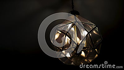 Beautiful chandelier in the loft hanging from the ceiling on a dark background. Close-up stock video footage