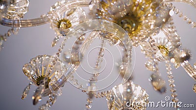 Beautiful close-up of a chandelier hanging from the ceiling. Bottom view. The lighting device shimmers with beautiful lights. Decor object stock video